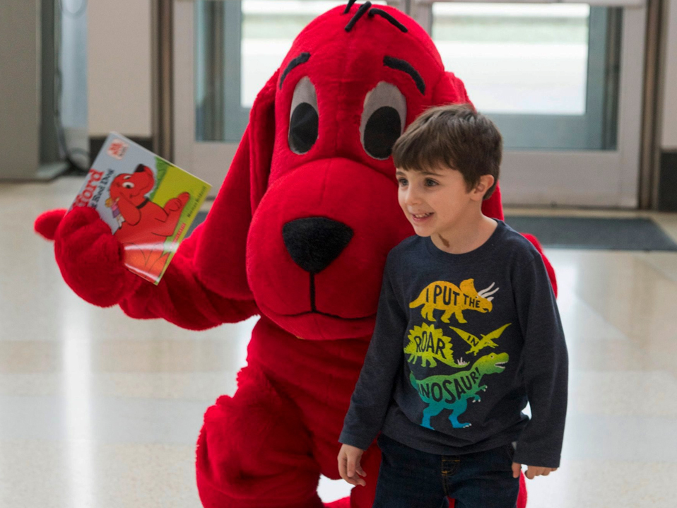 Child with Clifford the Big Red Dog