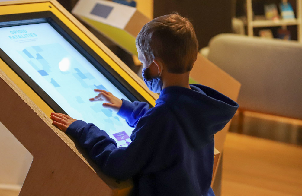 Kid Interacts with touch screen