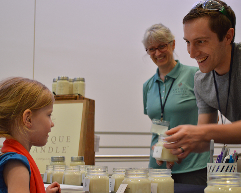 family engaging with activity at tinkerfest