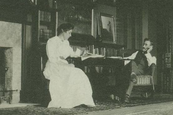 Selma and T.C. Steele sitting at table in library