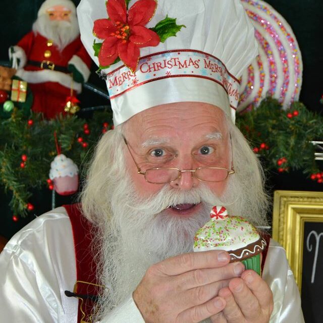 Circle City Santa posing with cupcake