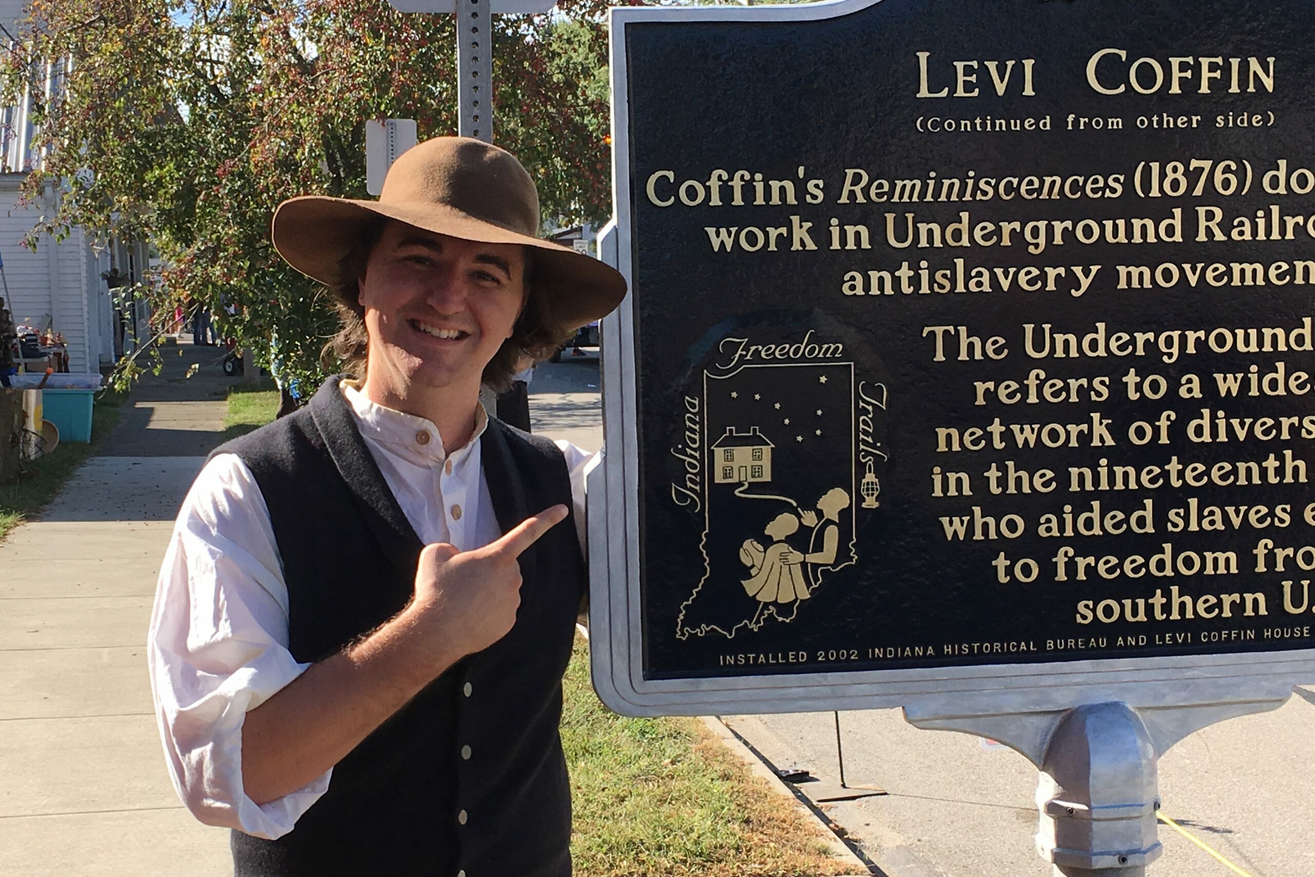 levi coffin interpreter pointing at historical levi coffin sign