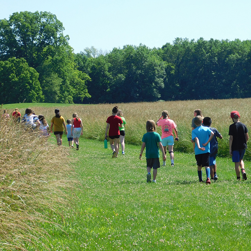 students walking at angel mounds state historic site