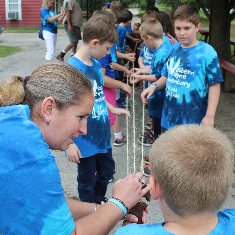 School group doing rope tying demonstration at Whitewater Canal State Historic Site