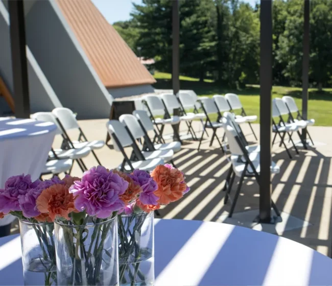 Flowers set out for wedding at Angel Mounds Rental Space
