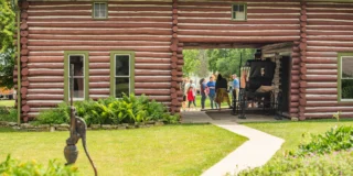 People gathered outside of event hosted at Molly Cotton on Limberlost Grounds