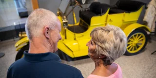 Couple looking at vintage car