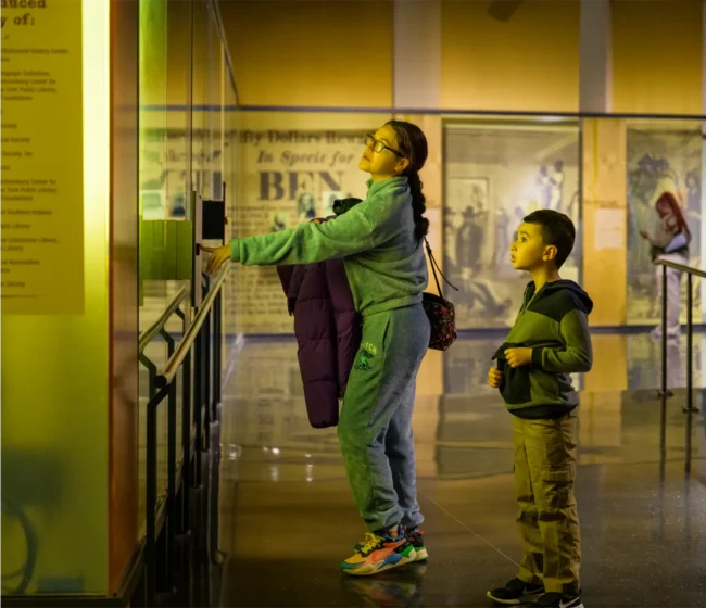 Mom and boy in Legacy Theater